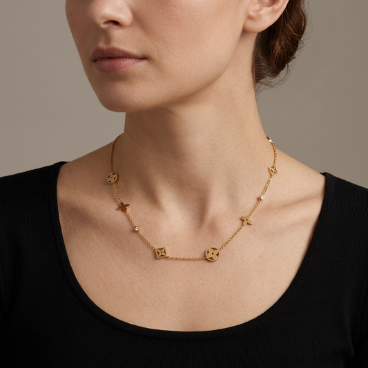 Model wearing the gold clover flower necklace with CZ accents