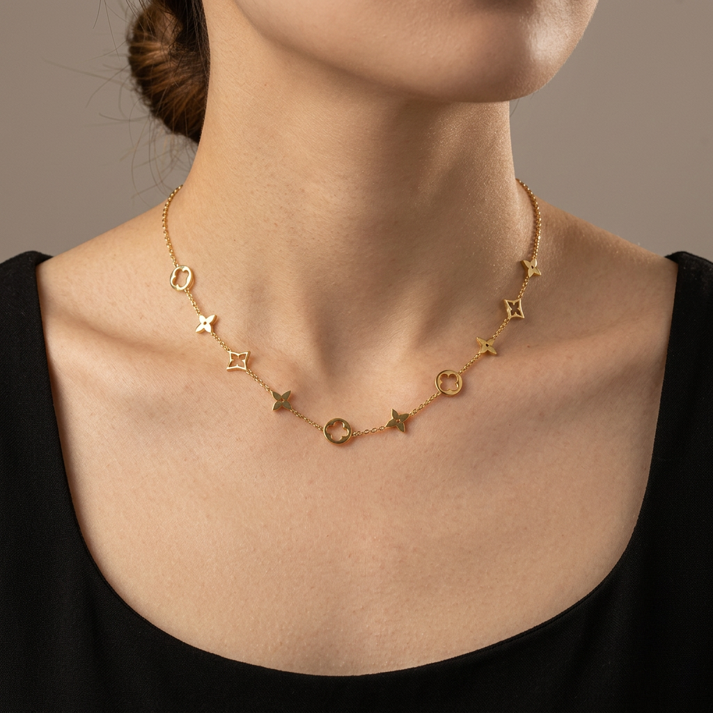 Model wearing the gold clover necklace.
