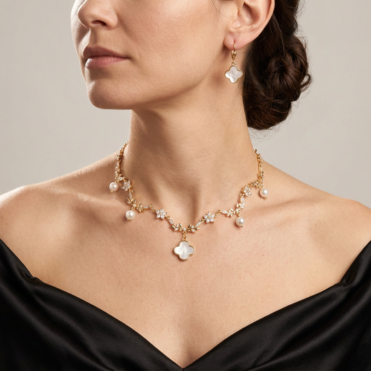 Mother of pearl clover necklace and matching leverback earrings worn together with a black satin gown